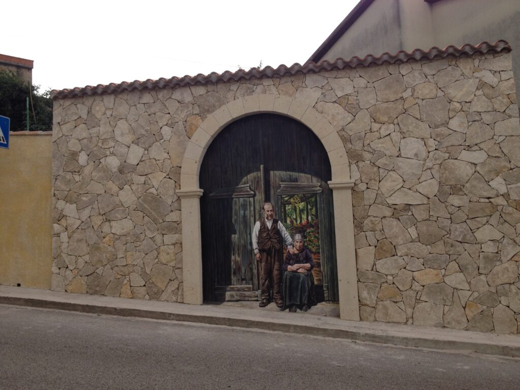 Wall paintings in Mogorella, Sardinia - La Porta Blu